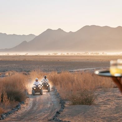 Adventure through the desert on a quadbike before a refreshing sundowner