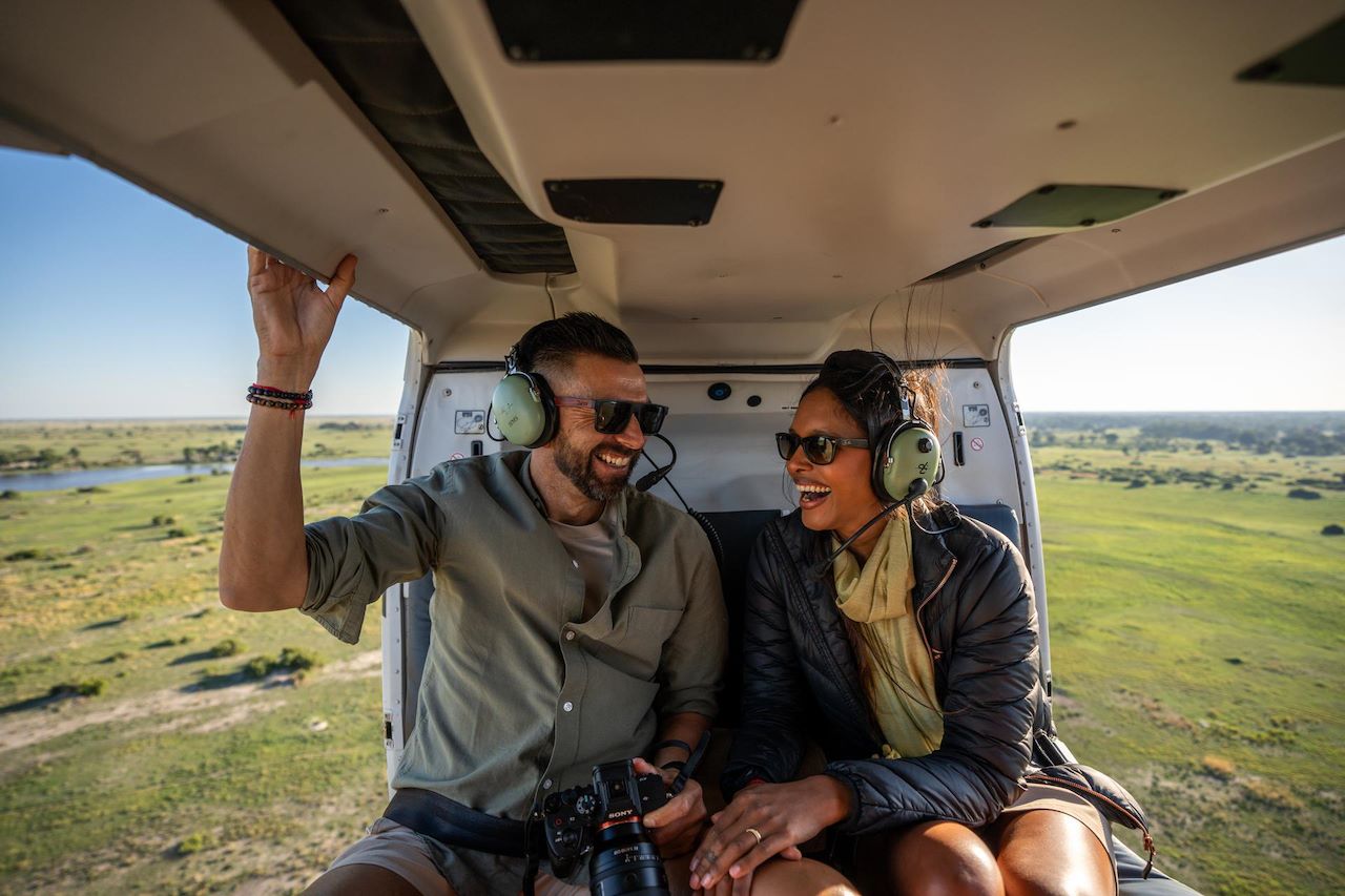 A couple enjoying a helicopter safari in Botswana