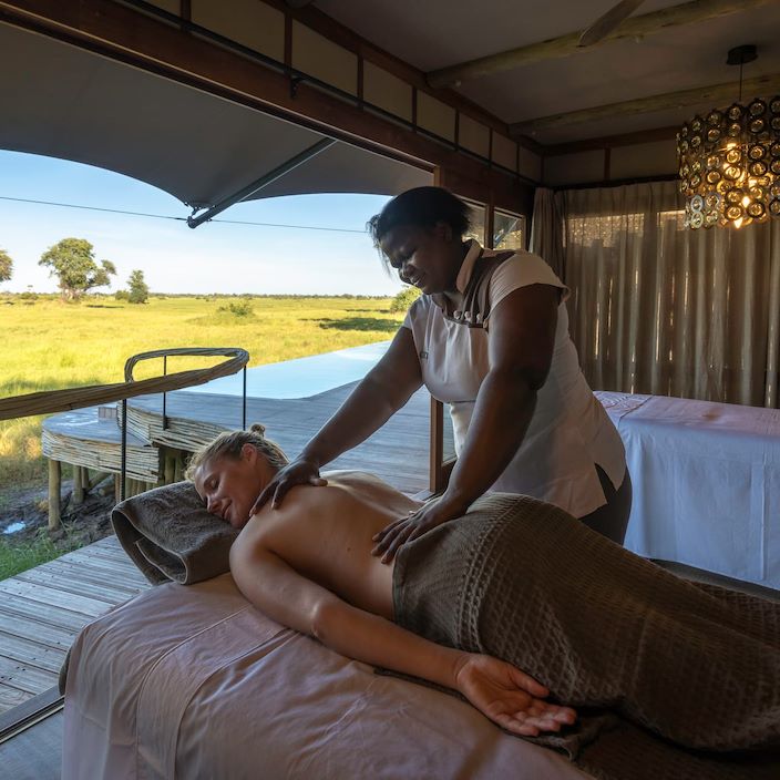 Lady enjoyig a revitalising massage in the Mombo Wellness centre